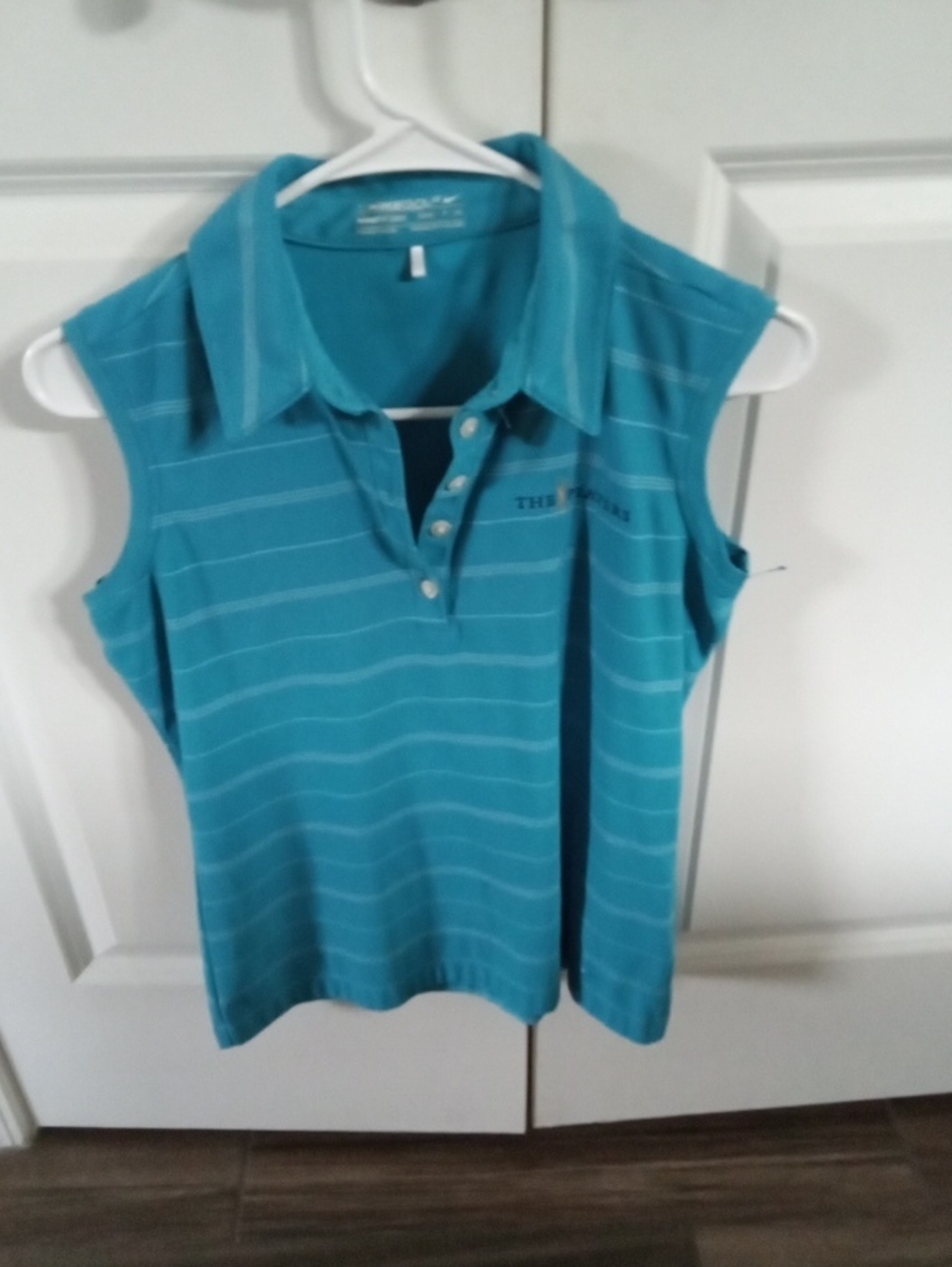 Nike GOLF  Women's Teal Striped Sleeveless Polo Tank with THE PLAYERS logo.